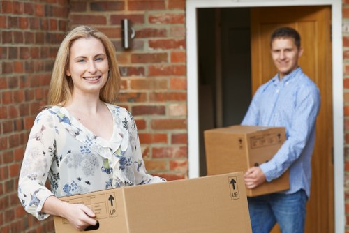 Professional movers loading furniture during a Streatham same day move