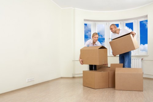 Unpacking service helping arrange household items in a Streatham home