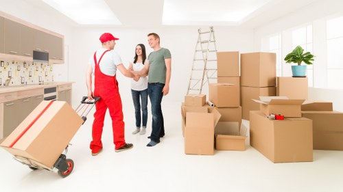Professional movers loading furniture for a Streatham house removal