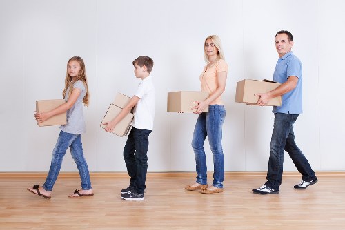 Mover carrying boxes during a Streatham man and van booking