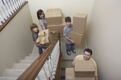 Local house movers carefully handling furniture during a Streatham relocation